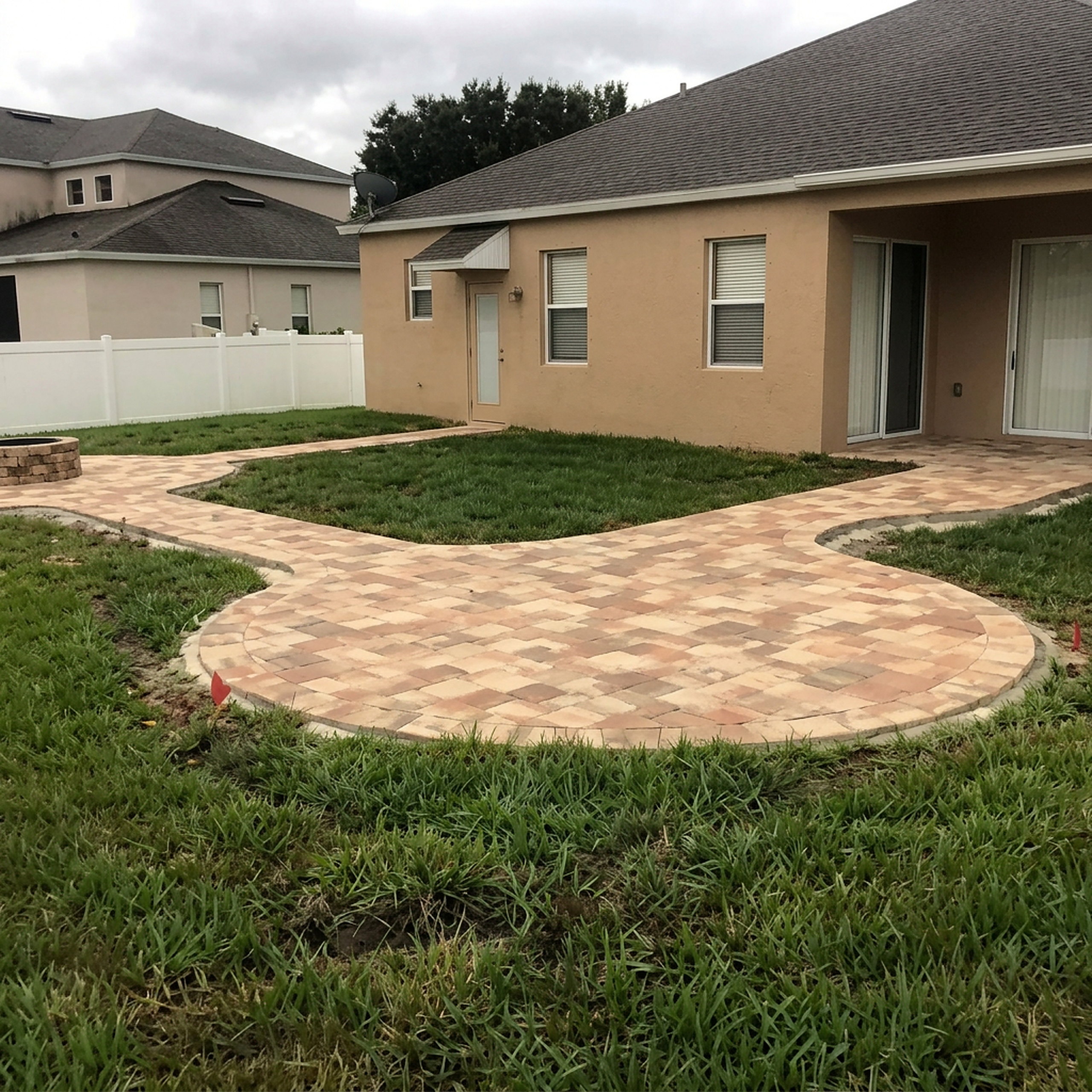 Rounded paver patio with curved soldier course