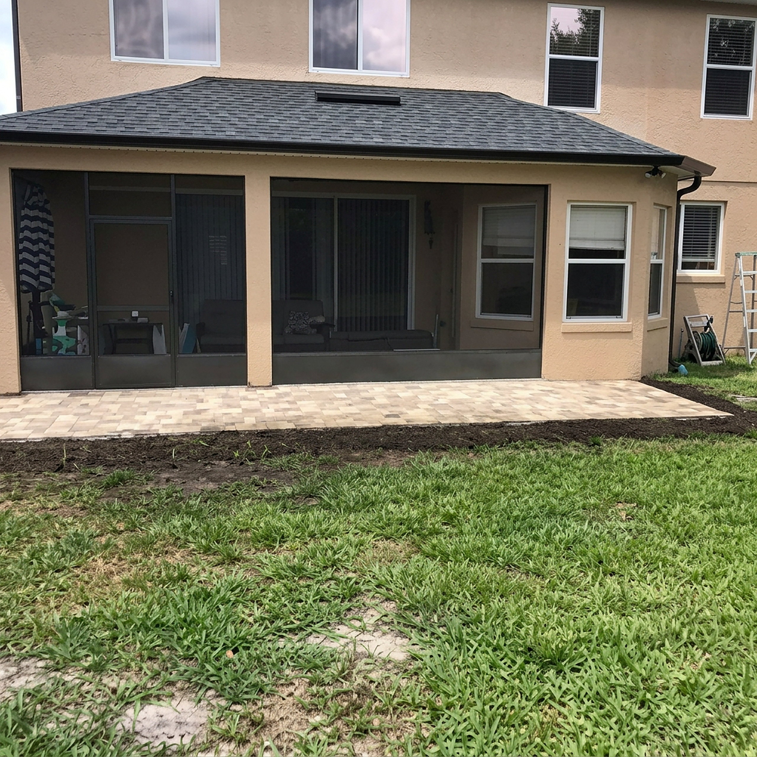 Square paver patio with screen enclosure