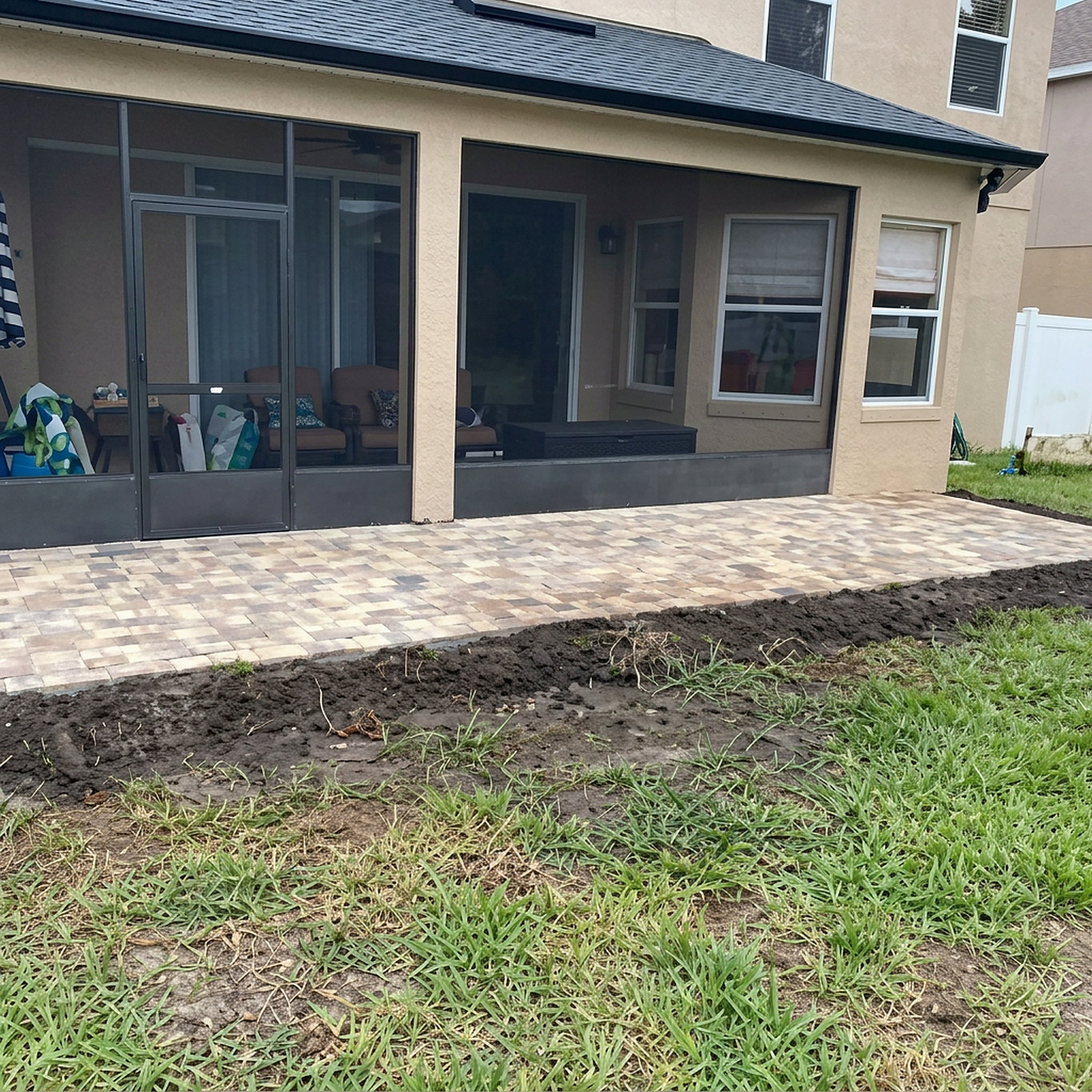 Square paver patio with raised step