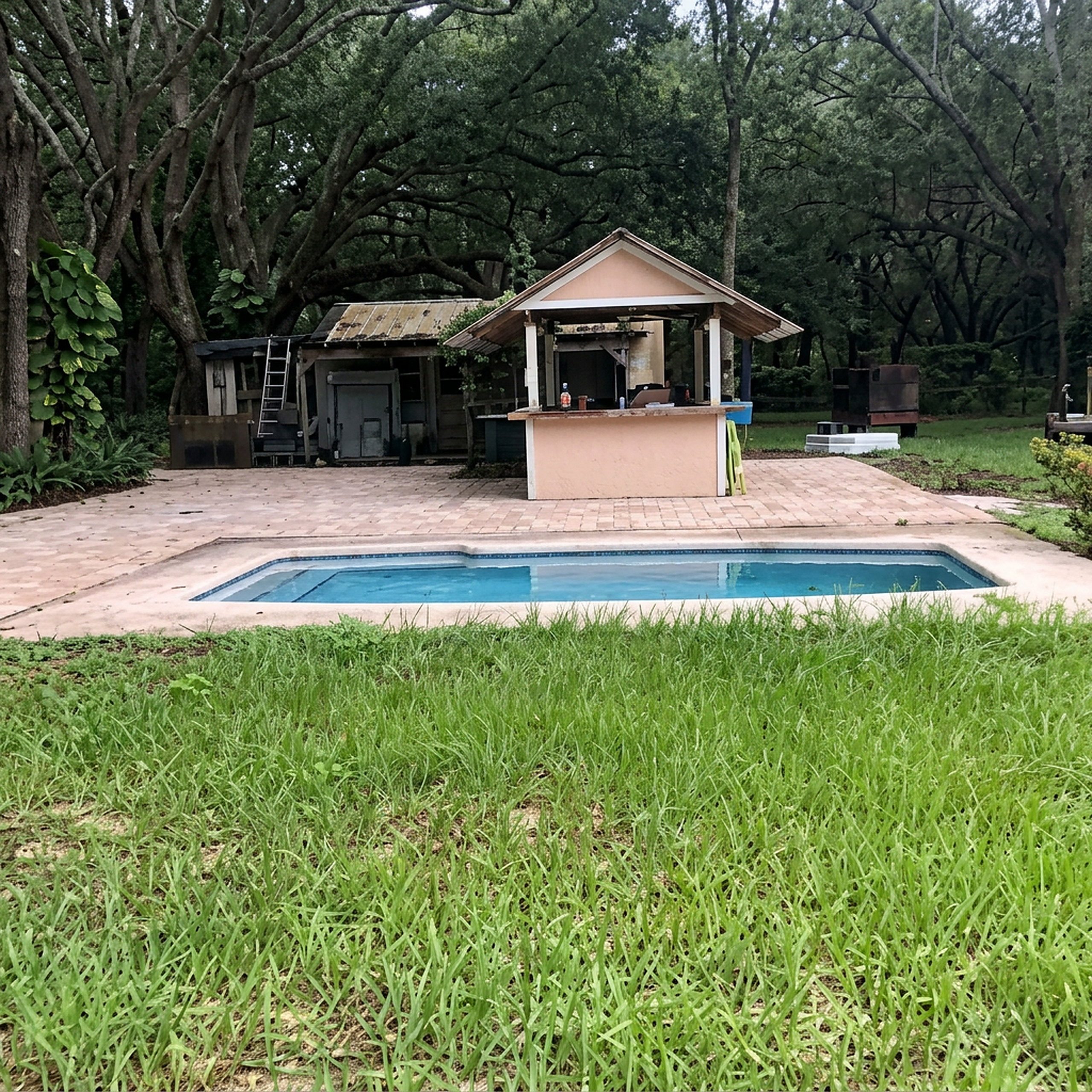 Paver pool deck and pool house