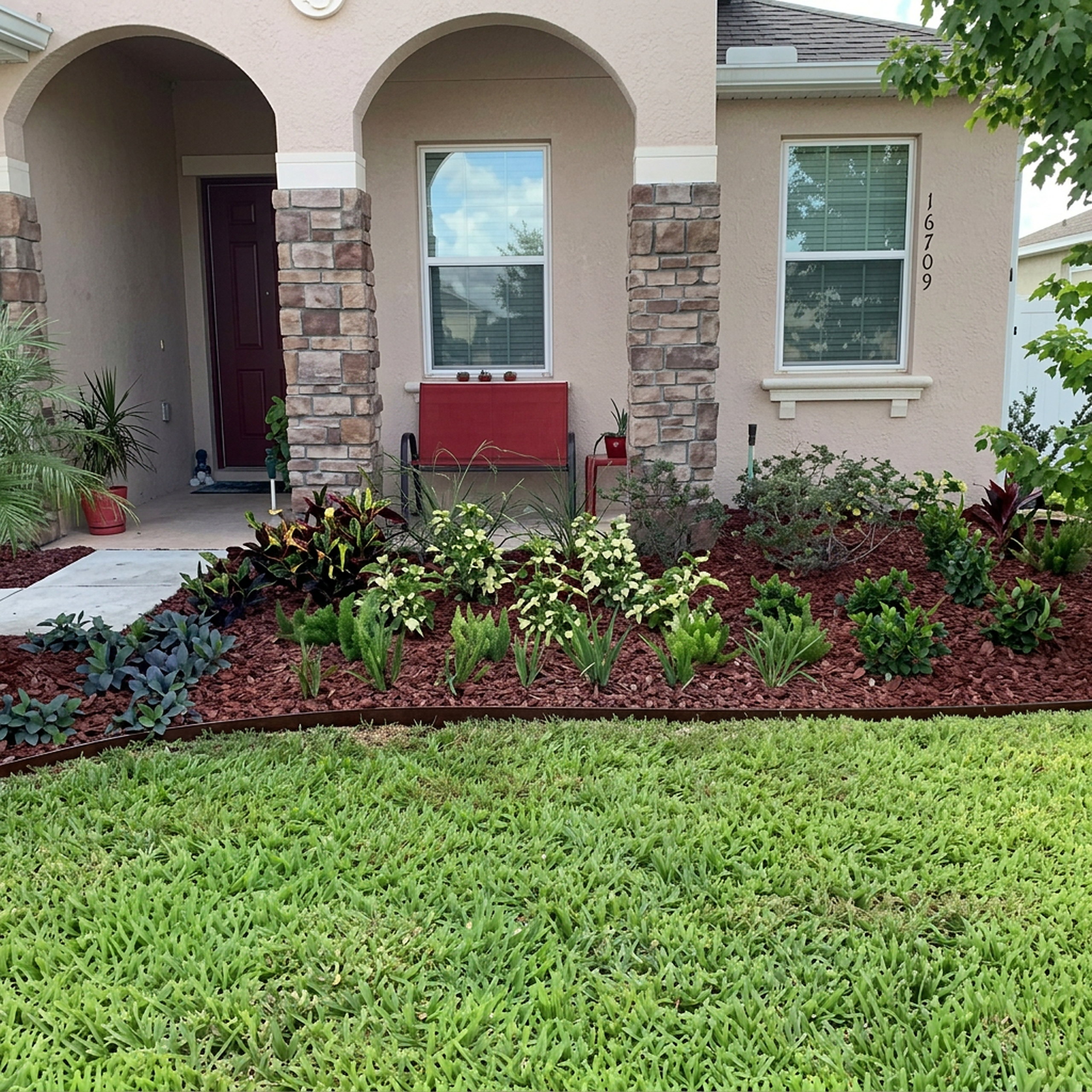 Front entry landscape bed with paver border