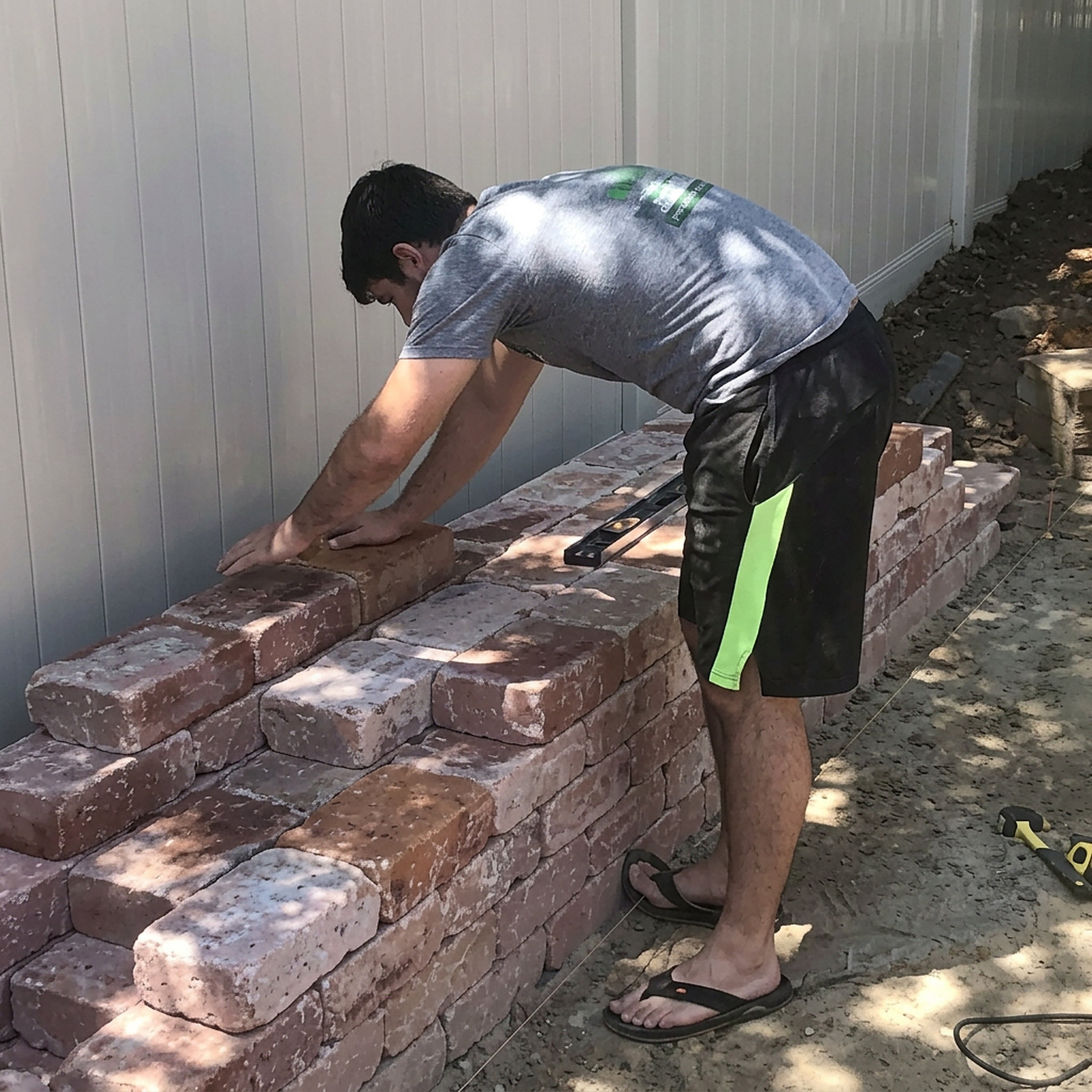 Brick retaining wall build along property line